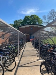 2 long lines of bikes parked in cycle storage